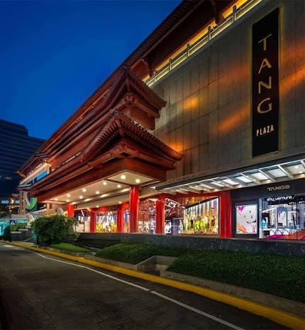 Tang Plaza’s red pagoda roof lit up at dusk on Orchard Road