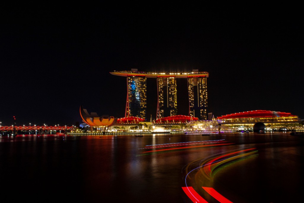 Marina Bay Sands and the ArtScience Museum lit up at night across the bay